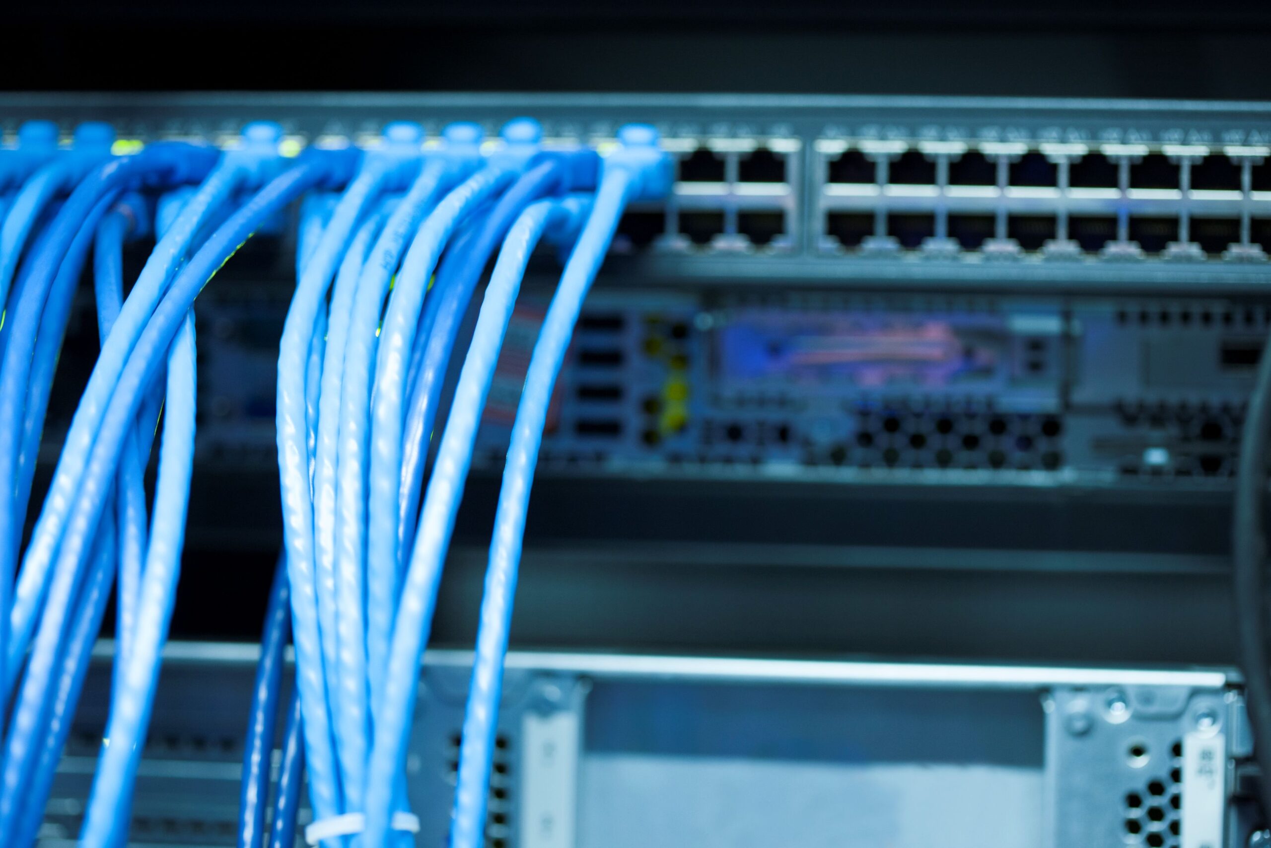 Structured Cat6 data cabling connected to a network switch – Nexa Data Solutions installation Illawarra & Shoalhaven